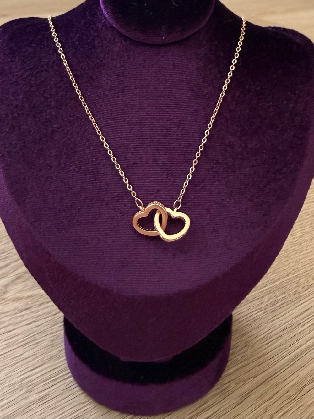 Rose gold necklace with interlocking heart pendant